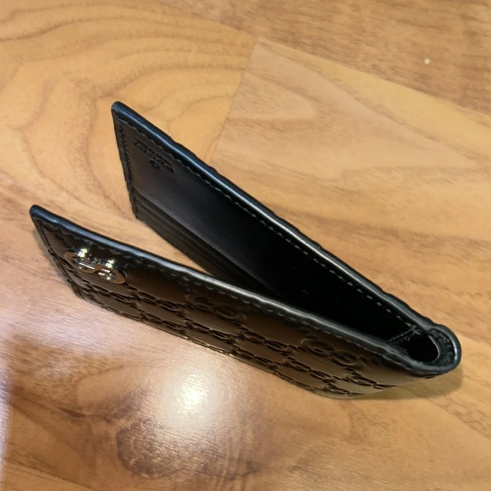Authentic Gucci Dorian Signature Embossed Leather Bifold Wallet
